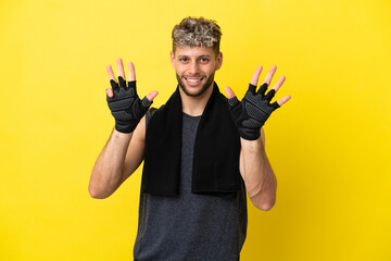 Sport caucasian man isolated on yellow background counting nine with fingers