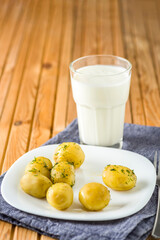 New potatoes sprinkled with dill served with kefir.