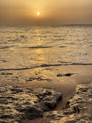 Golden hour in the reflection of the waves and the shores of the Red Sea