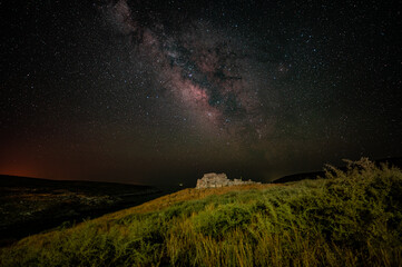 Milky Way in the night sky above the Temple of Poseidon at the southern tip of the Mani of the Peloponnese, Cape Matapan, Greece