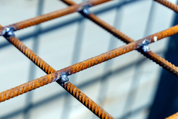 Place of welding of metal lattice from reinforcement - obrazy, fototapety, plakaty