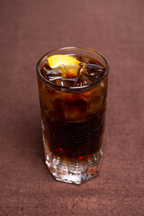 top view carbonated refreshing drink with ice and lemon in a glass glass