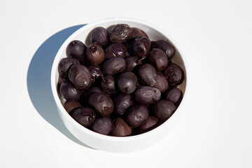 olives in a bowl on white background