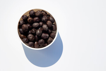 olives in a bowl on white background