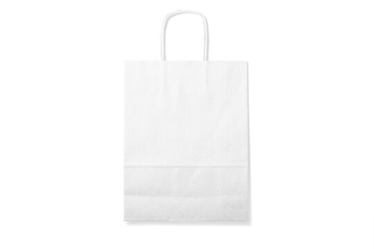 White kraft paper shopping bag with handles isolated on a transparent background, PNG. High resolution.
