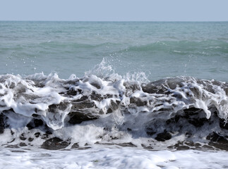 Sea waves on a sandy beach - 612110377