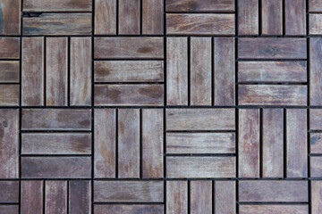 Abstract wooden floor background. Square geometric shape from small weathered planks. Copy space for your text or decoration.