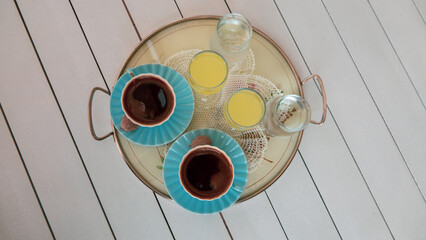 turkish coffee served with a little cookie and lemon liqueur or  limoncello  on tray per two person...