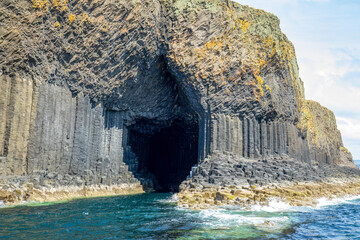 Fingal's cave, a sea cave on the uninhabited island of Staffa, in the Inner Hebrides of Scotland known for its natural acoustics. It got named Fingal's cave after a poem by James  MacPherson. 