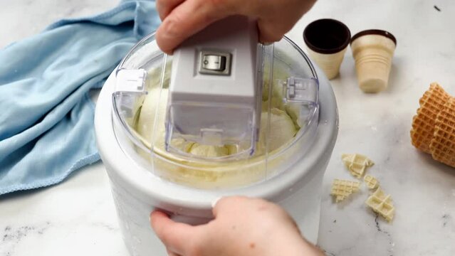 Homemade vanilla ice cream in ice cream maker. Close up