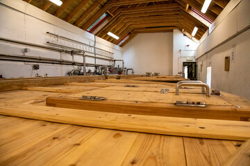 Wooden tanks which make up part of the distilling process of scottish whisky in a small distillery in Tobermory, Isle of Mull 