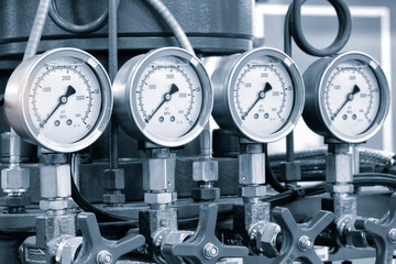 Industrial  concept. equipment of the boiler-house, - valves, tubes, pressure gauges, thermometer. Close up of manometer, pipe, flow meter, water pumps and valves of heating system in a boiler room. - obrazy, fototapety, plakaty