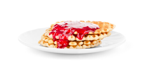 waffles drenched raspberry jam on a white plate