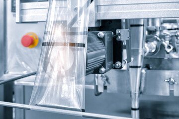 Automatic industrial machine for plastic packaging with light effect of products and food....