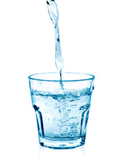 pouring water on a glass on white background