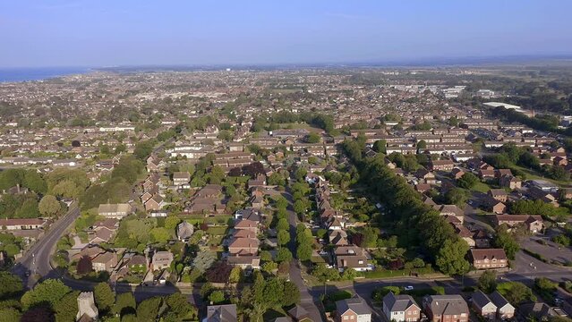 Aerial footage over Hurst Road in Rustington looking west and beyond from East Preston in West Sussex on the South coast of England.