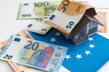 House laying on a 50 euros banknote. Concept of house and money. 