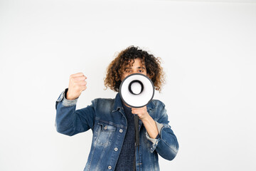 young man holding a megaphone while posing against a white background