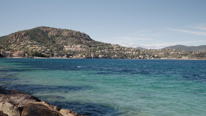 View of Theoule-Sur-Mer from a beach in spring
