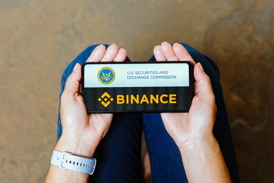 June 11, 2023, Brazil. In this photo illustration, the Securities and Exchange Commission (SEC) and Binance logo is displayed on a smartphone screen.