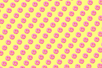 pink donuts on light yellow background small size