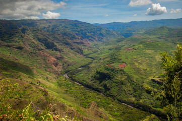 Fototapeta premium Waimea Canyon, also known as the Grand Canyon of the Pacific. Is a large canyon, approximately ten miles long and up to 3,000 feet deep, located on the western side of Kauaʻi in the Hawaiian Islands.