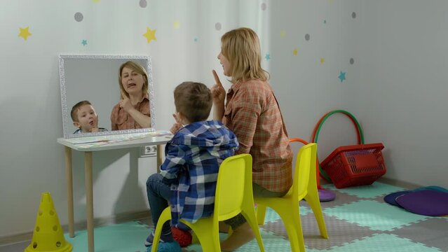 Speech Therapy for Boys. Enhancing Language Skills with a Professional Speech-Language Pathologist. High quality 4k footage