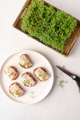 Healthy snacks or starter, appetizer with organic microgreens growing at home for healthy eating or for restaurant. Top view