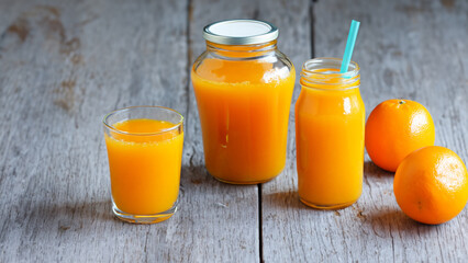 Obraz na płótnie Canvas Fresh orange juice in the glass jar - generative ai