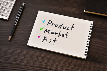 There is notebook with the word Product Market Fit. It is as an eye-catching image.
