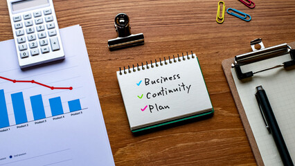 There is notebook with the word Business Continuity Plan. It is as an eye-catching image.