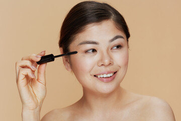 Fototapeta premium Portrait of young woman with mascara
