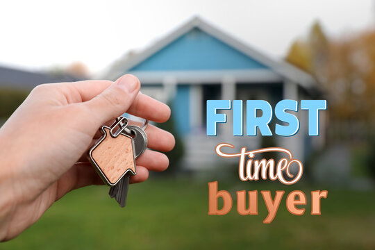First-time buyer. Woman holding house keys outdoors, closeup