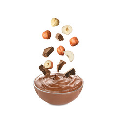 Making yummy chocolate paste. Hazelnuts and pieces of chocolate falling into bowl on white...