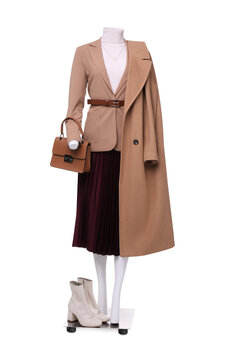 Female mannequin dressed in jacket, turtleneck, skirt and trench coat with accessories isolated on white. Stylish outfit