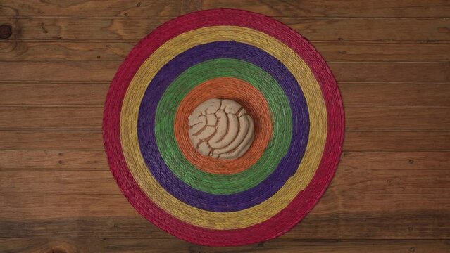 Mexican Concha Sweet bread Scone Tablecloth and wood Surface putting the bread