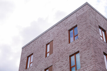 Brick buildings with windows symbolize strength, stability, and urban progress, capturing the essence of business and industry