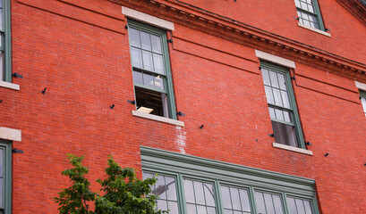 Brick buildings with windows symbolize strength, stability, and urban progress, capturing the essence of business and industry