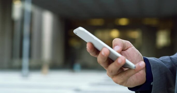 Phone, city hands and business man typing email, online app search or check corporate data on mobile app. Cellphone, closeup agent and urban person networking, texting or message smartphone user