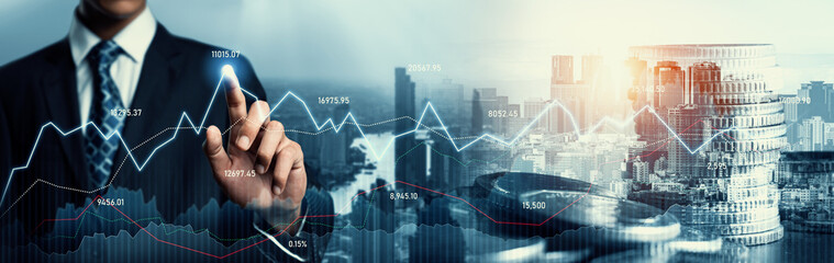 Businessman analyst working with digital finance business data graph showing technology of investment strategy for perceptive financial business decision. Digital economic analysis technology concept.