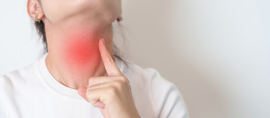 Woman checking Thyroid gland disease. Hand holding Neck pain. Hyperthyroidism, Hypothyroidism,...