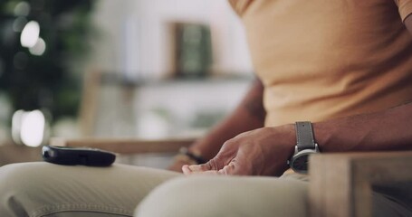 Blood sugar, finger stab and man hands in a home living room checking insulin monitor. Male African person, house and lounge sofa with digital glucose meter for health monitoring and wellness test