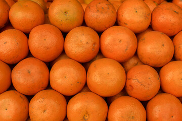 Orange fruit background. Close-up of oranges on a market