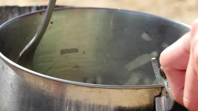Stirring vegetables in a pot