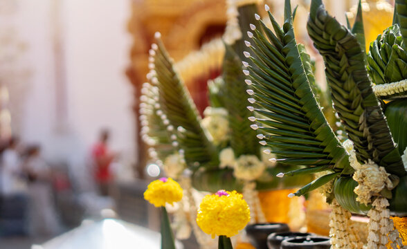 Cropped image of Thai blessing ceremony or a banana leaf and flower tray set up for pray in a temple