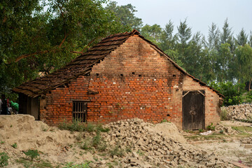 05-06-2023. Burul, West Bengal, India: The houses in al village of Bengal in India to store bricks in a traditional brick factory.