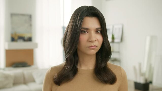 Series of real people emotions and face expressions. Hate and anger concept slow motion. Portrait of beautiful hateful woman feeling disgust and fury. Young girl nasty face is angry and dissatisfied