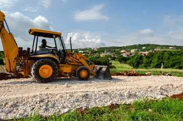 Operating a Front-end Loader on a Marl Road