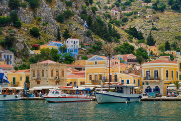Fototapeta na wymiar Symi, a beautiful small Greek island near Rhodes, which is visited by many tourists due to its colorful houses