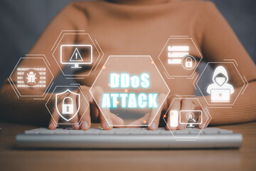DDoS attack concept, Person typing on keyboard computer with DDoS attack icon on virtual screen, security concept. - obrazy, fototapety, plakaty